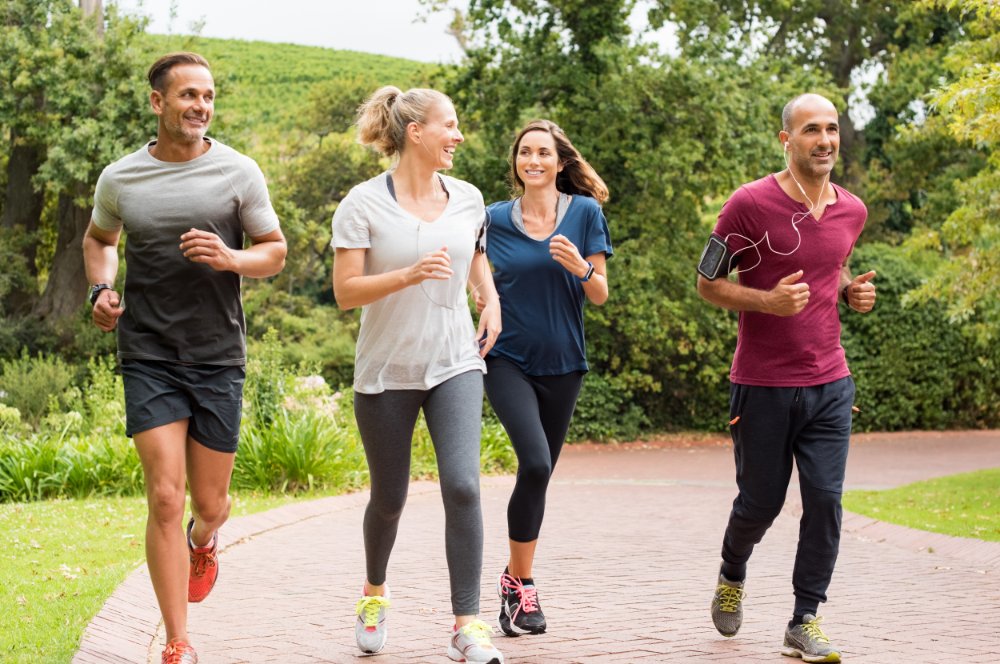 Group adults jogging in park